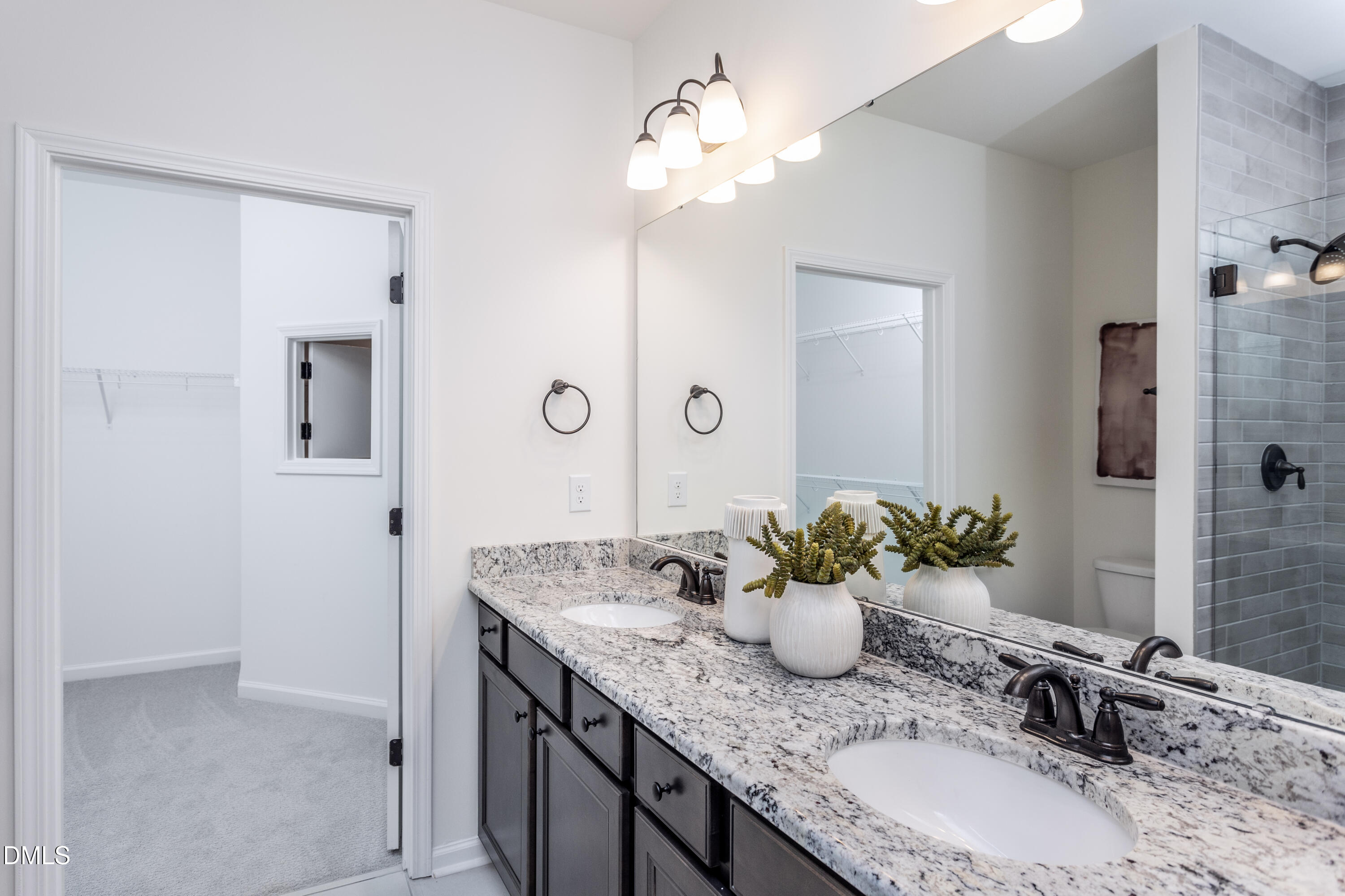 35 Rockingham Way Clayton, NC 27520 - Photo 11 of 42 a bathroom with a granite countertop sink and a mirror