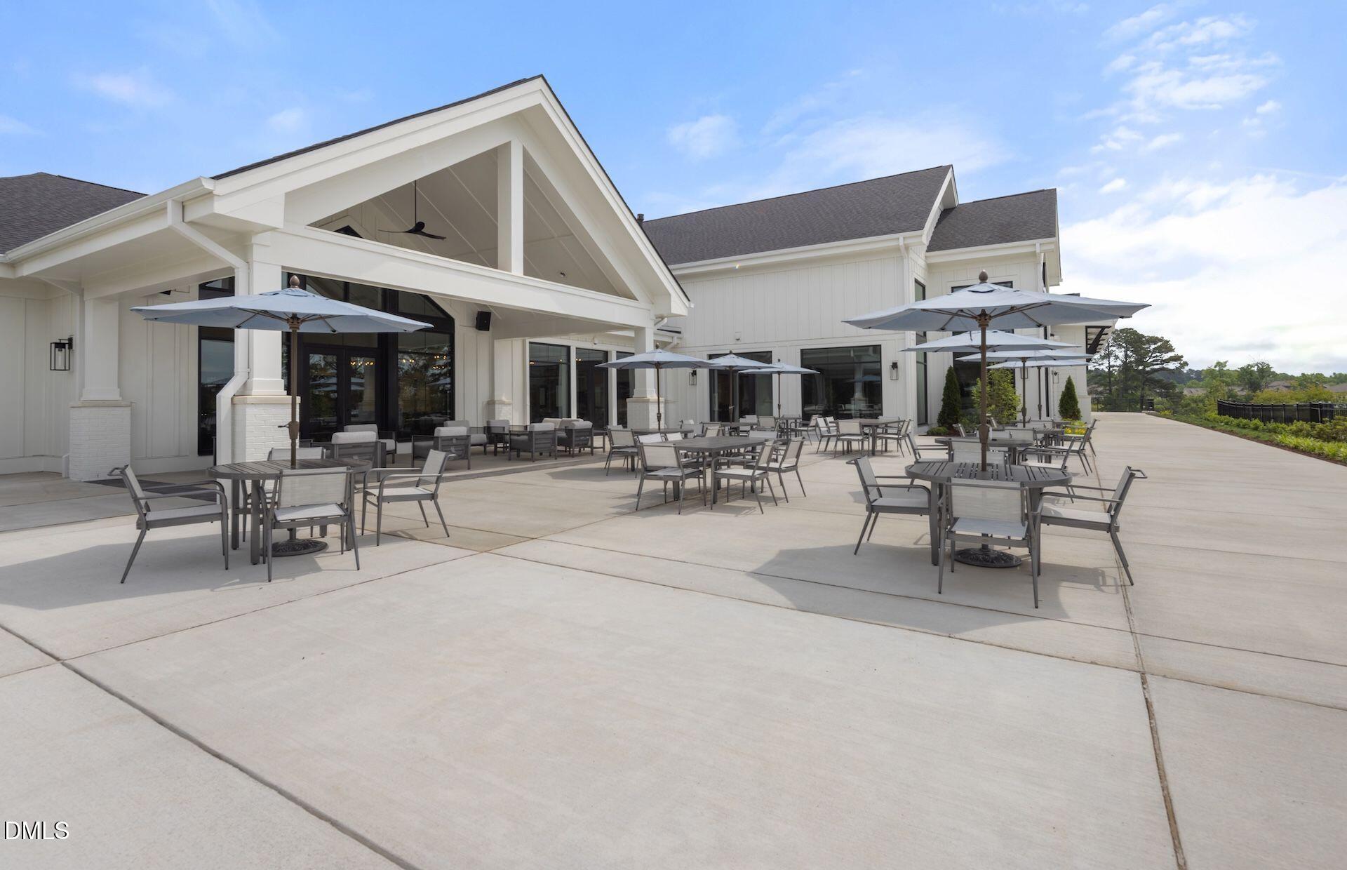 35 Rockingham Way Clayton, NC 27520 - Photo 25 of 42 a view of a patio with dining table and chairs