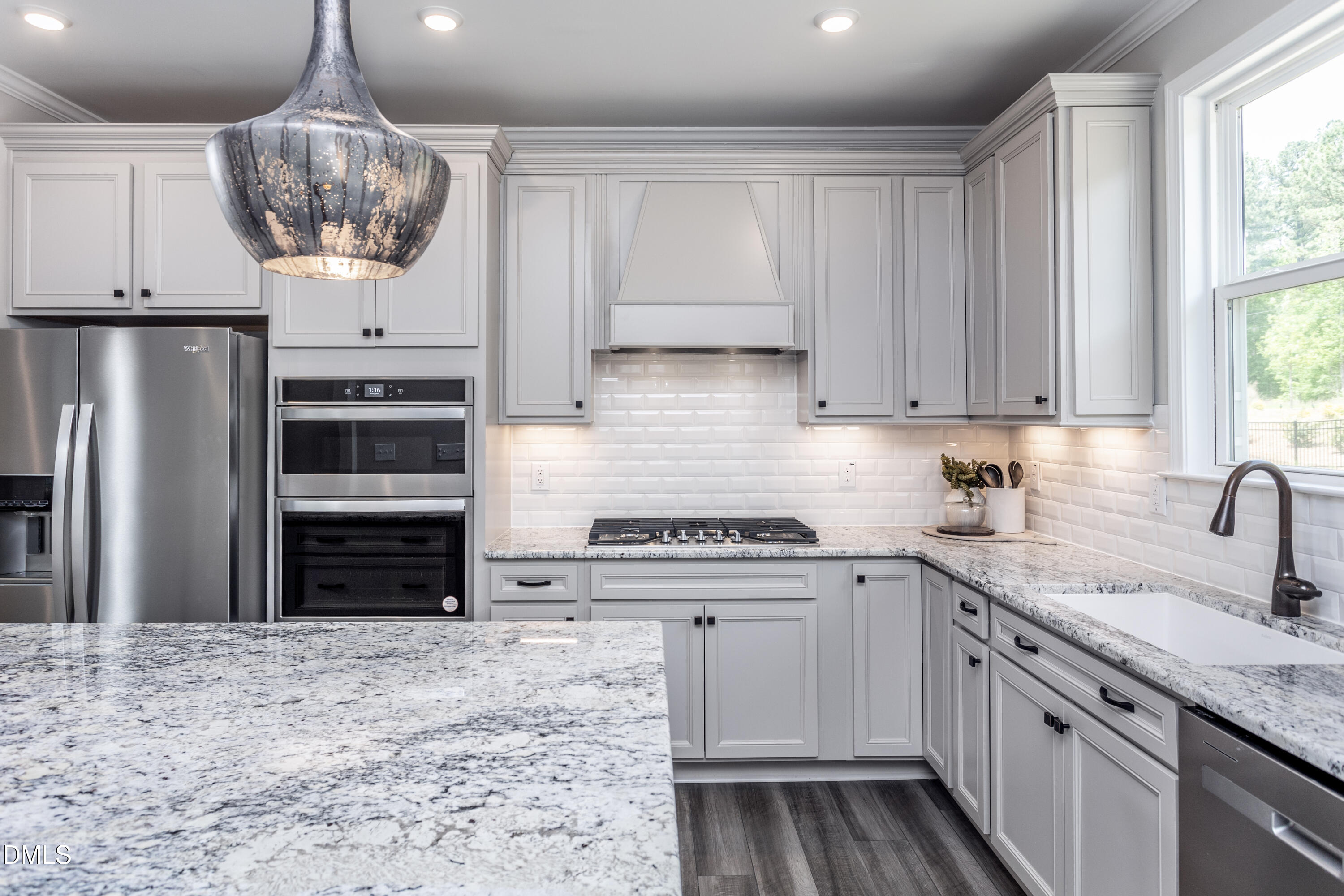 35 Rockingham Way Clayton, NC 27520 - Photo 4 of 42 a kitchen with a sink and cabinets