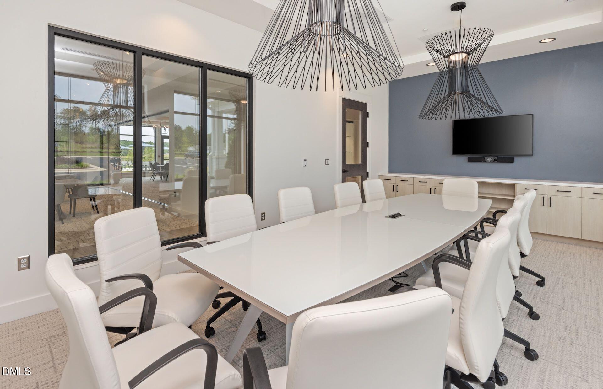 35 Rockingham Way Clayton, NC 27520 - Photo 42 of 42 a view of a dining room with furniture wooden floor and chandelier