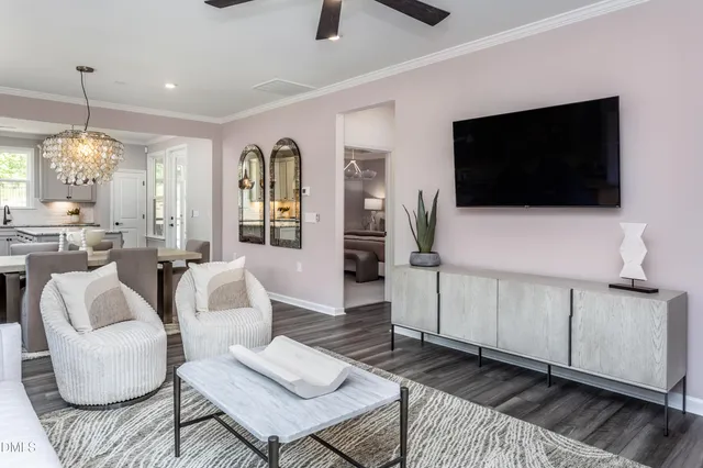 a living room with furniture and a flat screen tv