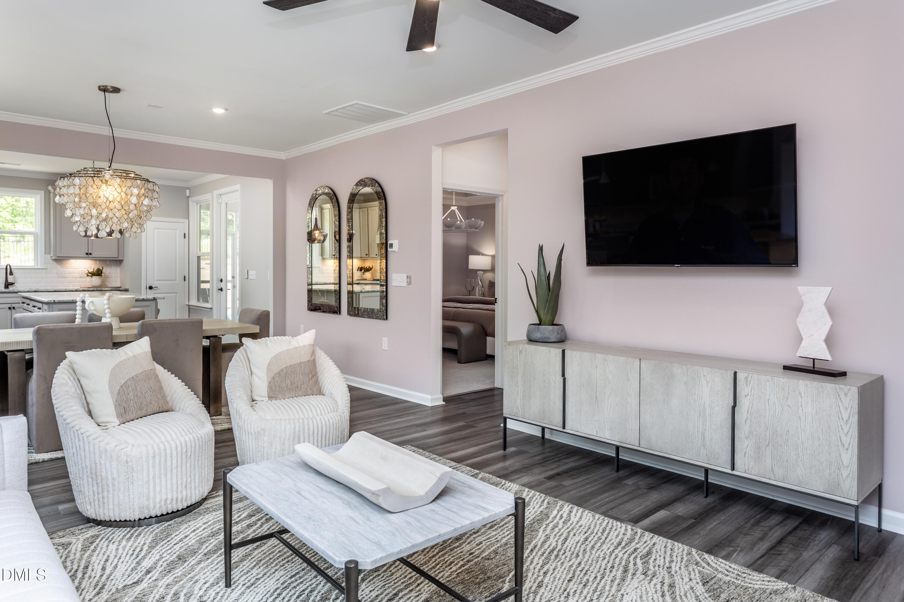 35 Rockingham Way Clayton, NC 27520 - Photo 6 of 42 a living room with furniture and a flat screen tv