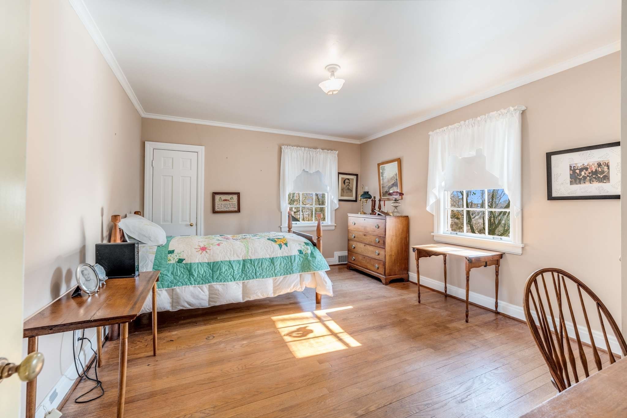 2429 Bear Road Nashville, TN 37215 - Photo 18 of 22 a spacious bedroom with a bed and a table in it