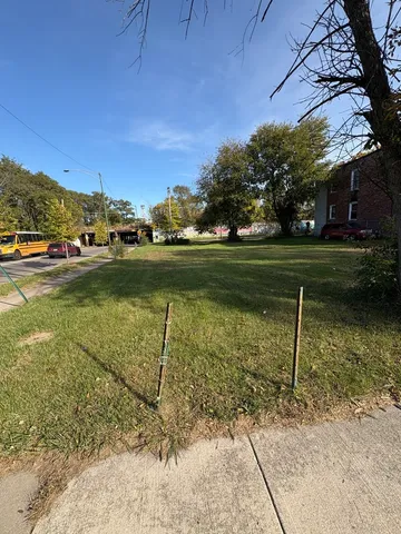a view of a swimming pool and a yard