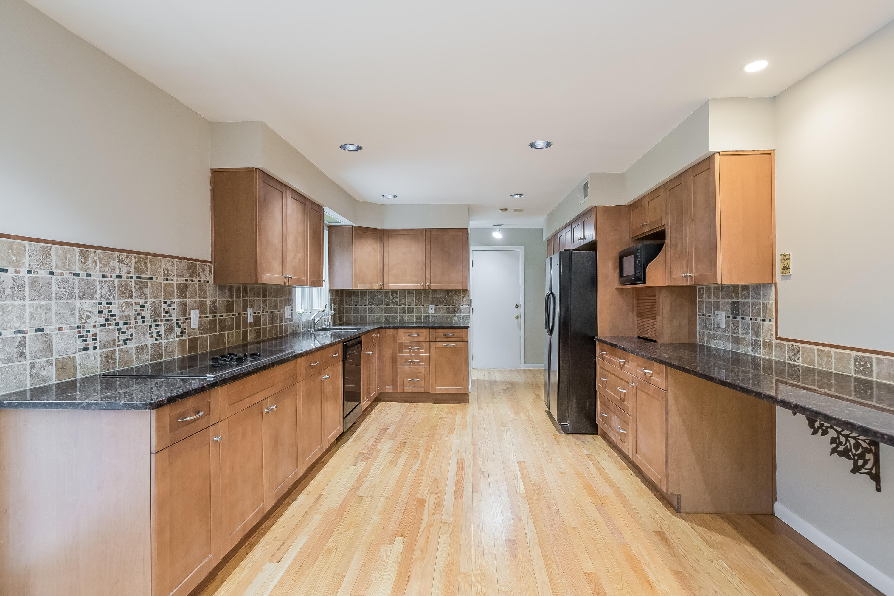 92 Rolling Ridge Road Stamford, CT 06903 - Photo 11 of 34 a large kitchen with stainless steel appliances granite countertop a lot of counter space and wooden floor