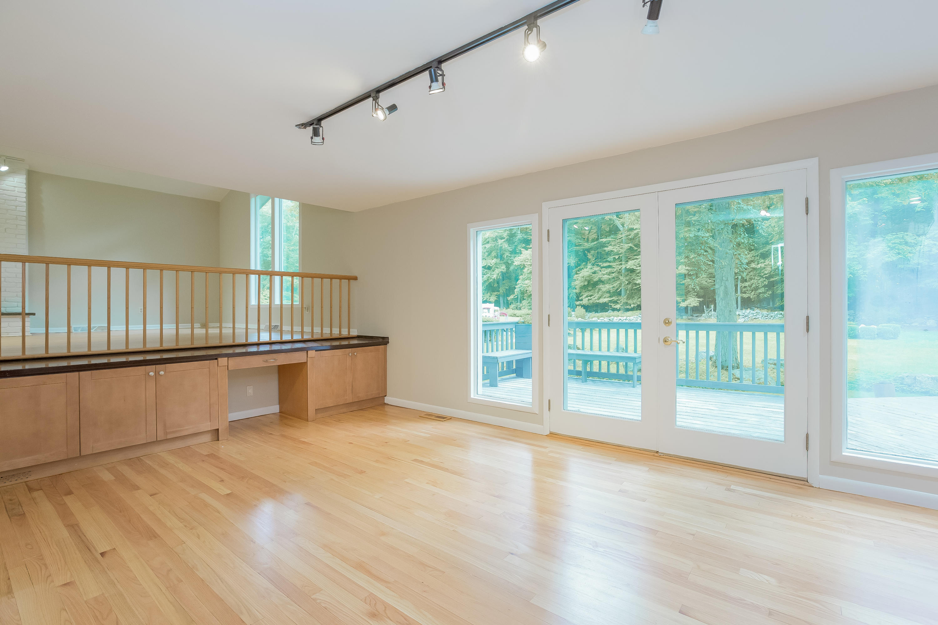 92 Rolling Ridge Road Stamford, CT 06903 - Photo 13 of 34 a view of an empty room with wooden floor and a window