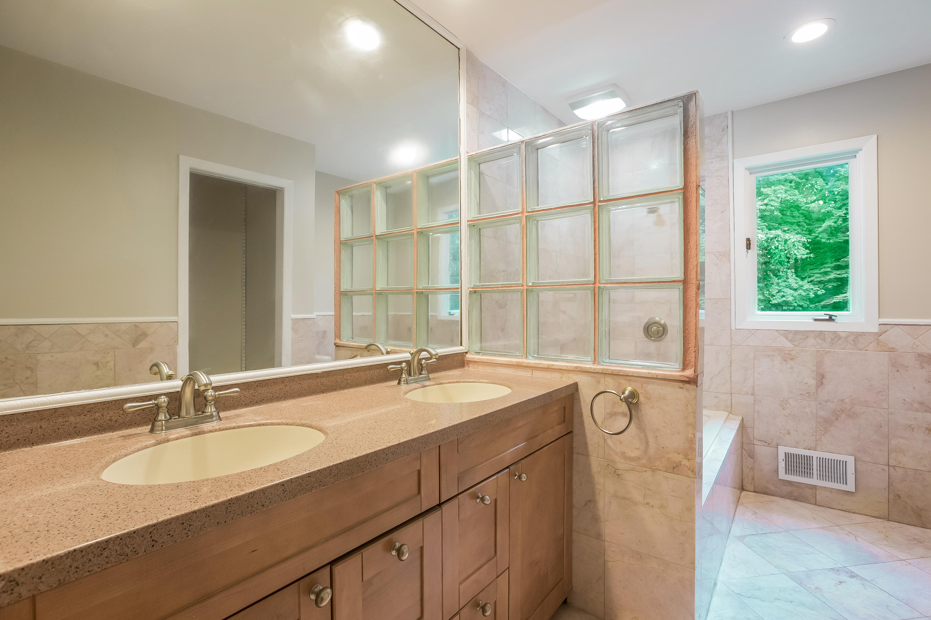 92 Rolling Ridge Road Stamford, CT 06903 - Photo 26 of 34 a bathroom with a granite countertop sink mirror and a bath tub
