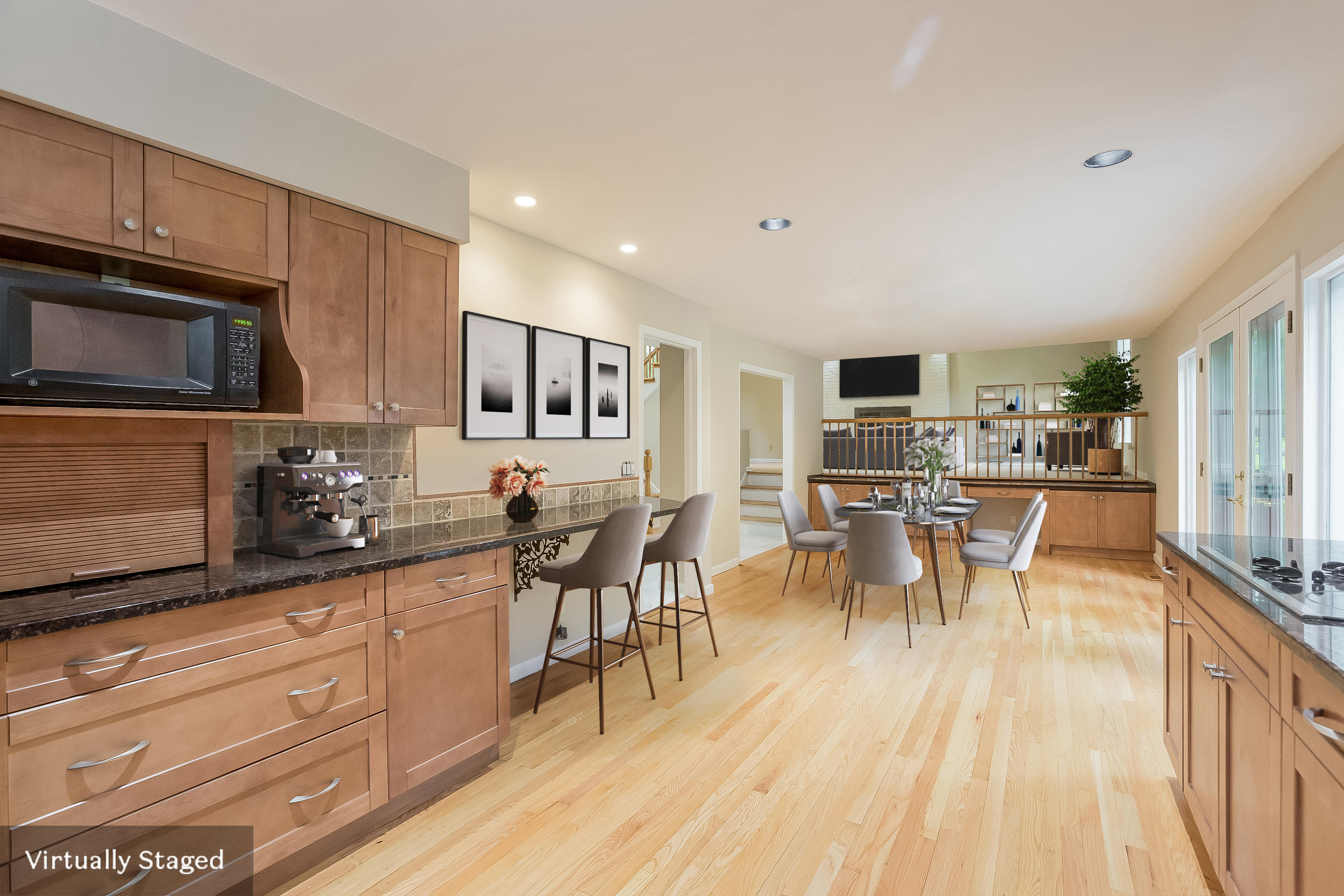 92 Rolling Ridge Road Stamford, CT 06903 - Photo 9 of 34 a kitchen with stainless steel appliances granite countertop a stove top oven a sink a dining table and chairs with wooden floor
