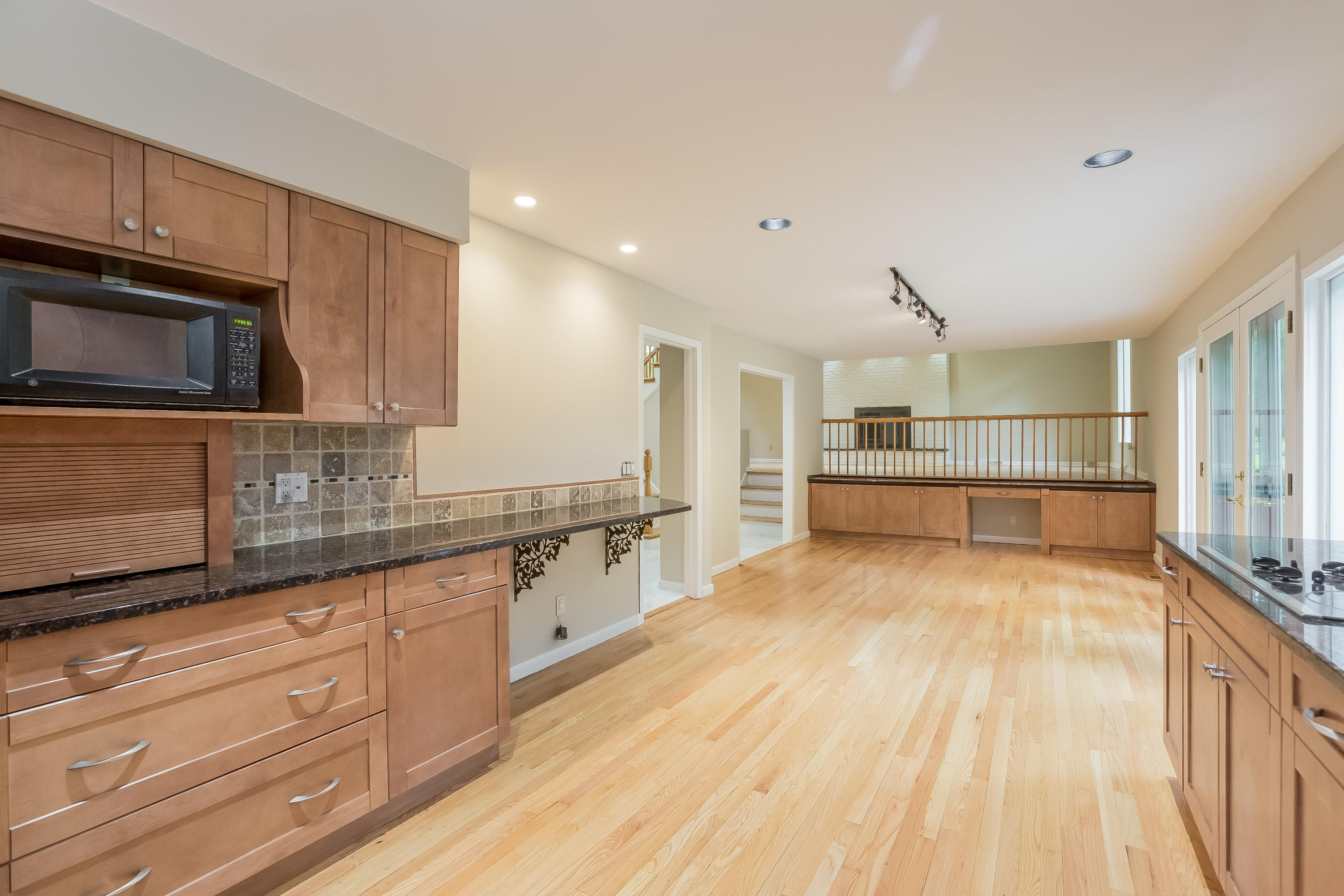92 Rolling Ridge Road Stamford, CT 06903 - Photo 10 of 34 a large kitchen with granite countertop a stove and a sink dishwasher a oven with wooden cabinets