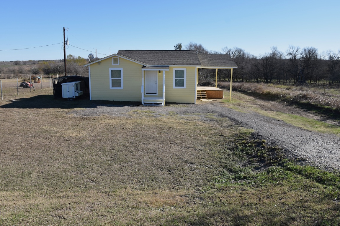3775 County Road 463 Elgin, TX 78621 - Photo 2 of 28 View of front of house with a porch and a shingled roof