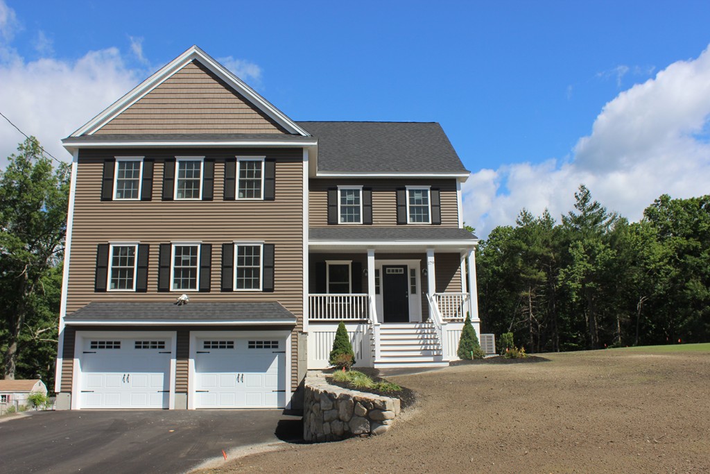 179 Groton Road Chelmsford, MA 01863 - Photo 1 of 19 a front view of a house with a yard