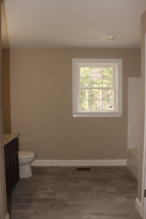179 Groton Road Chelmsford, MA 01863 - Photo 12 of 19 a view of a room with wooden floor and sink