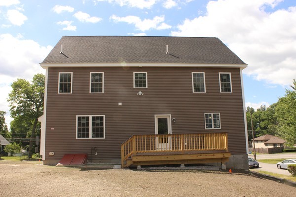 179 Groton Road Chelmsford, MA 01863 - Photo 18 of 19 a front view of a house with a garage