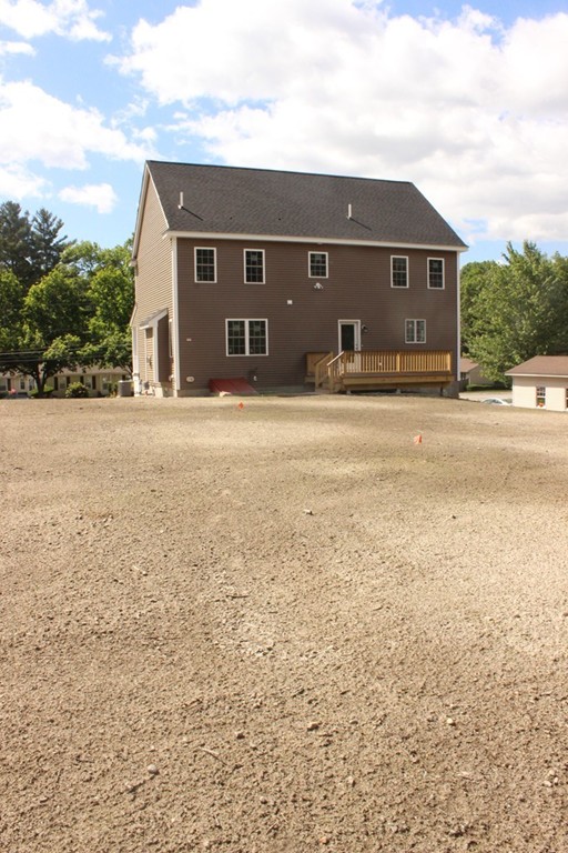 179 Groton Road Chelmsford, MA 01863 - Photo 19 of 19 front view of a house with a yard