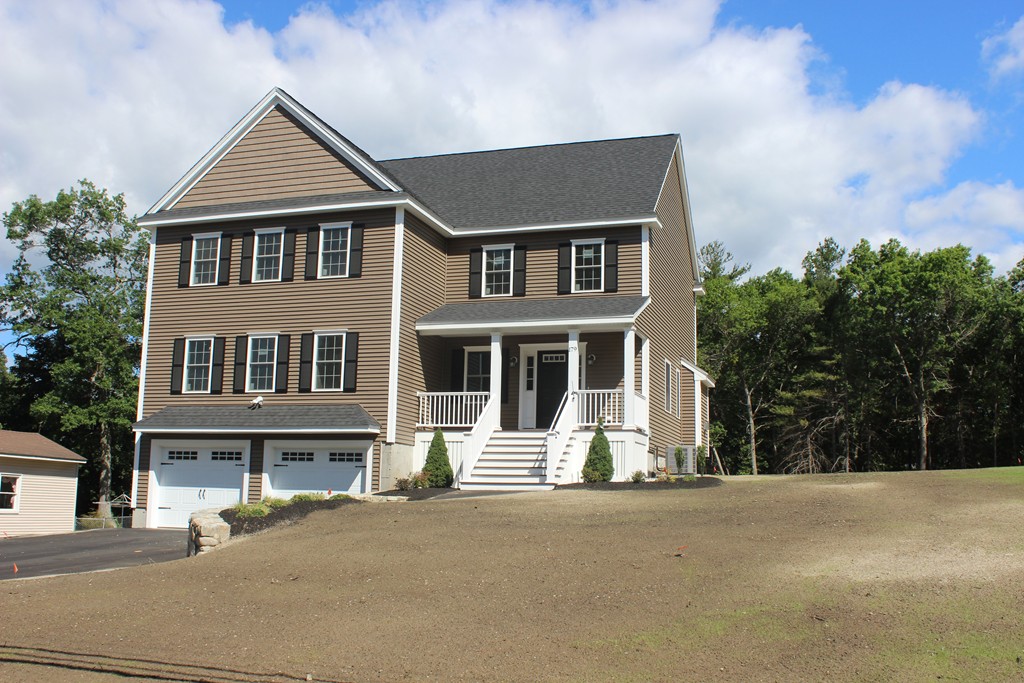 179 Groton Road Chelmsford, MA 01863 - Photo 2 of 19 a front view of a house with a garden