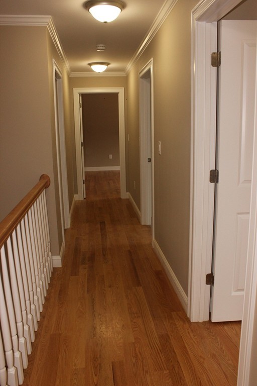 179 Groton Road Chelmsford, MA 01863 - Photo 9 of 19 a view of a hallway with wooden floor