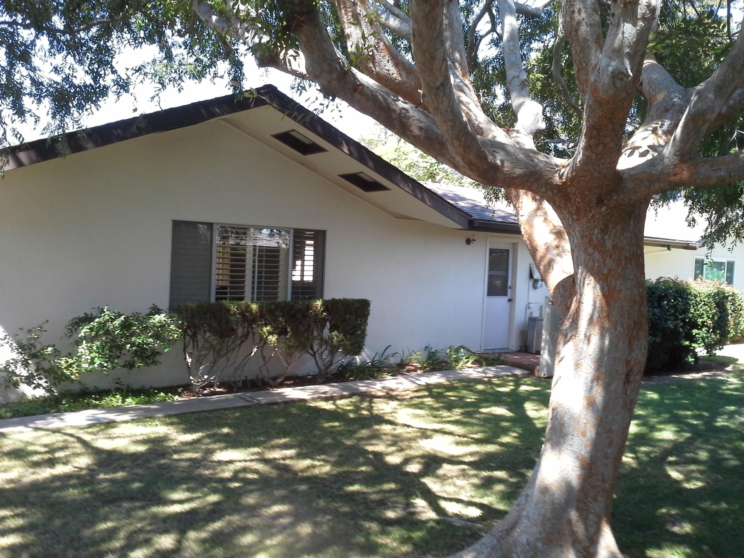 817 Cieneguitas Road Santa Barbara, CA 93110 - Photo 2 of 12 a house that has a tree in front of it