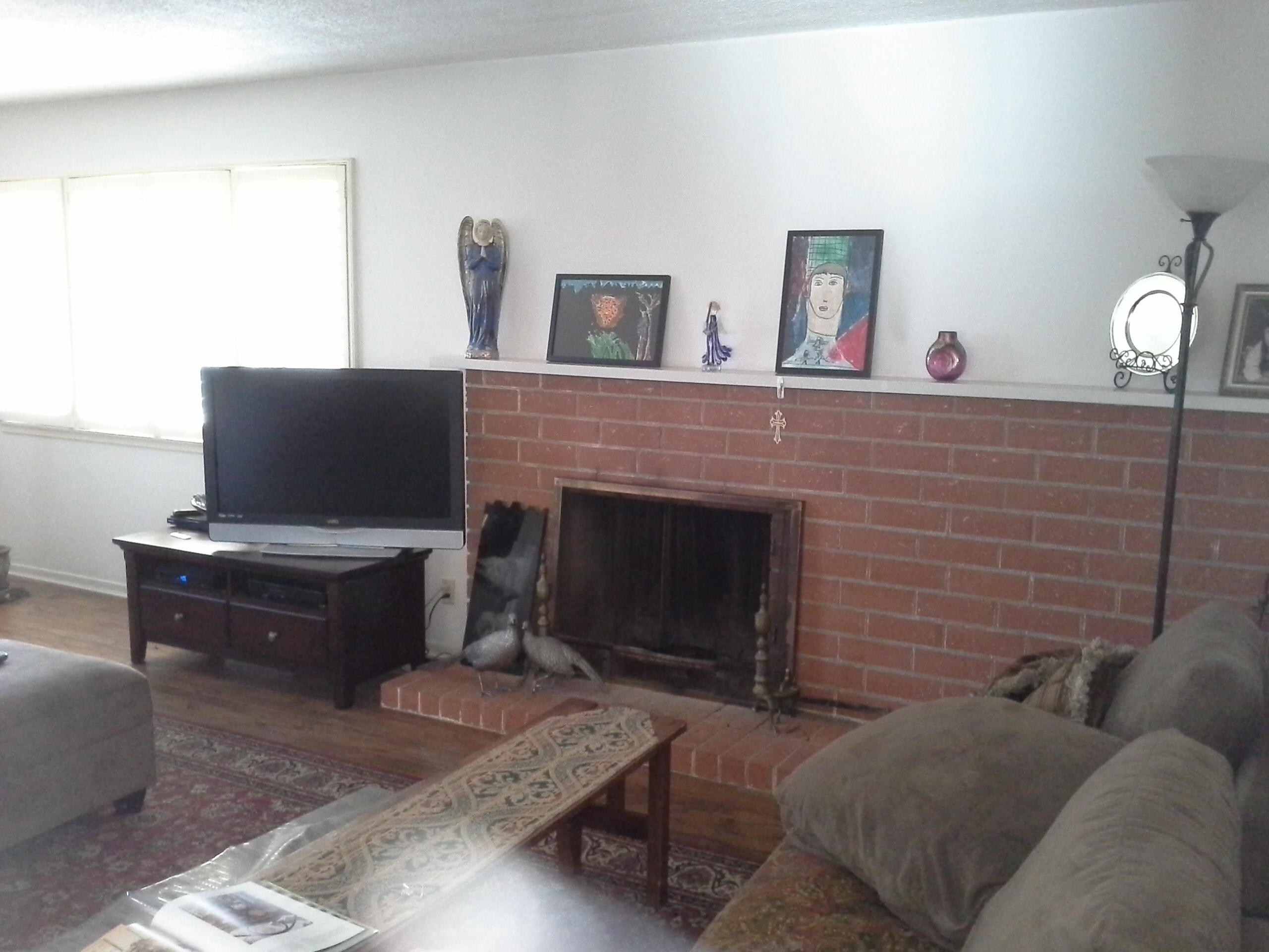 817 Cieneguitas Road Santa Barbara, CA 93110 - Photo 4 of 12 a living room with furniture and a fireplace