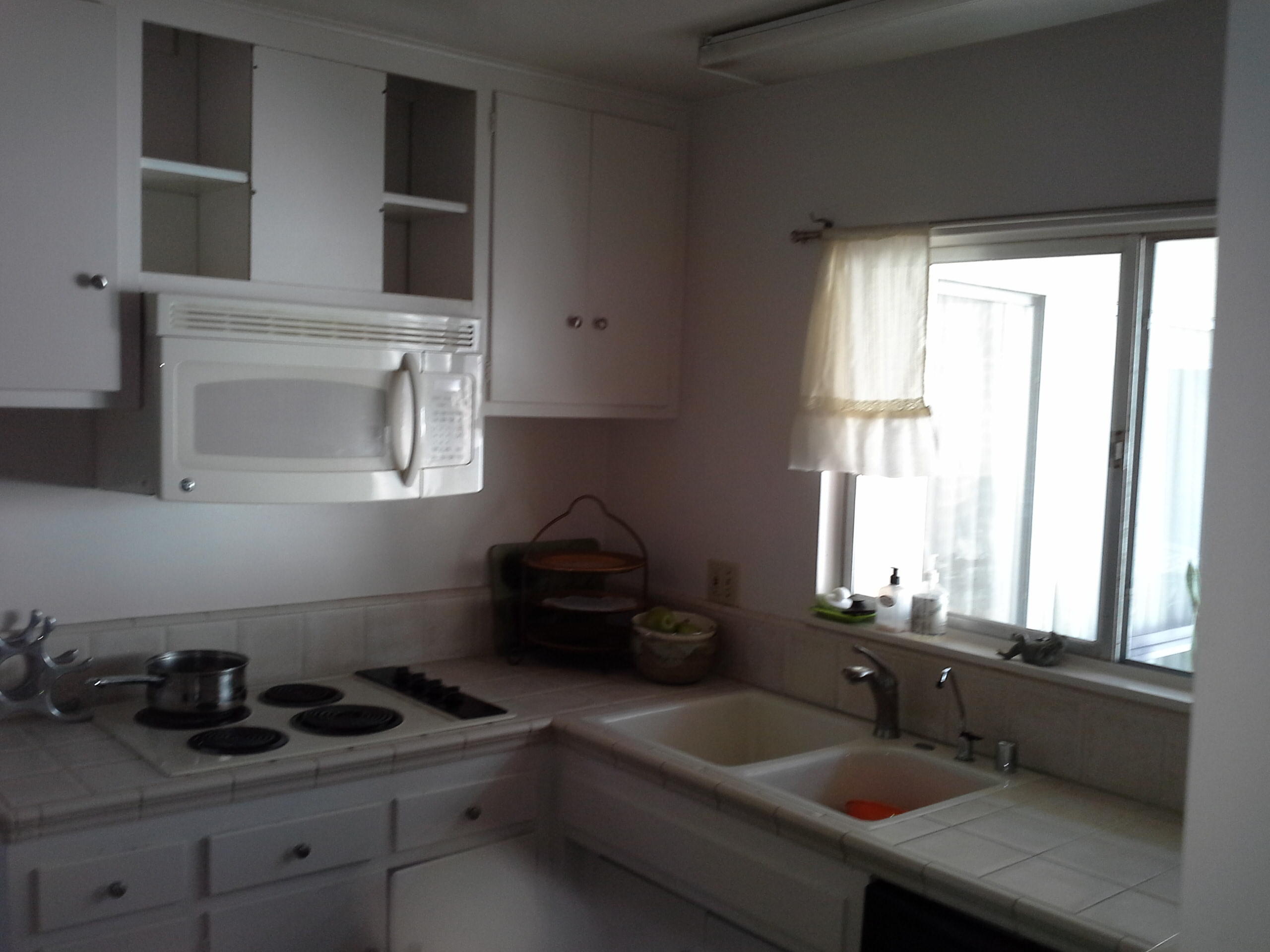 817 Cieneguitas Road Santa Barbara, CA 93110 - Photo 7 of 12 a kitchen with sink and window