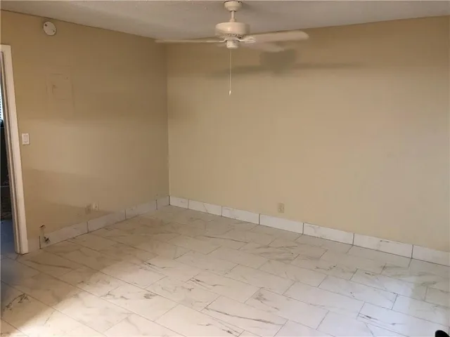 a view of walk in closet with clothes