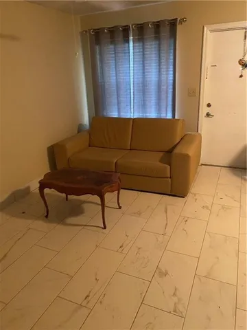a living room with a couch and a table