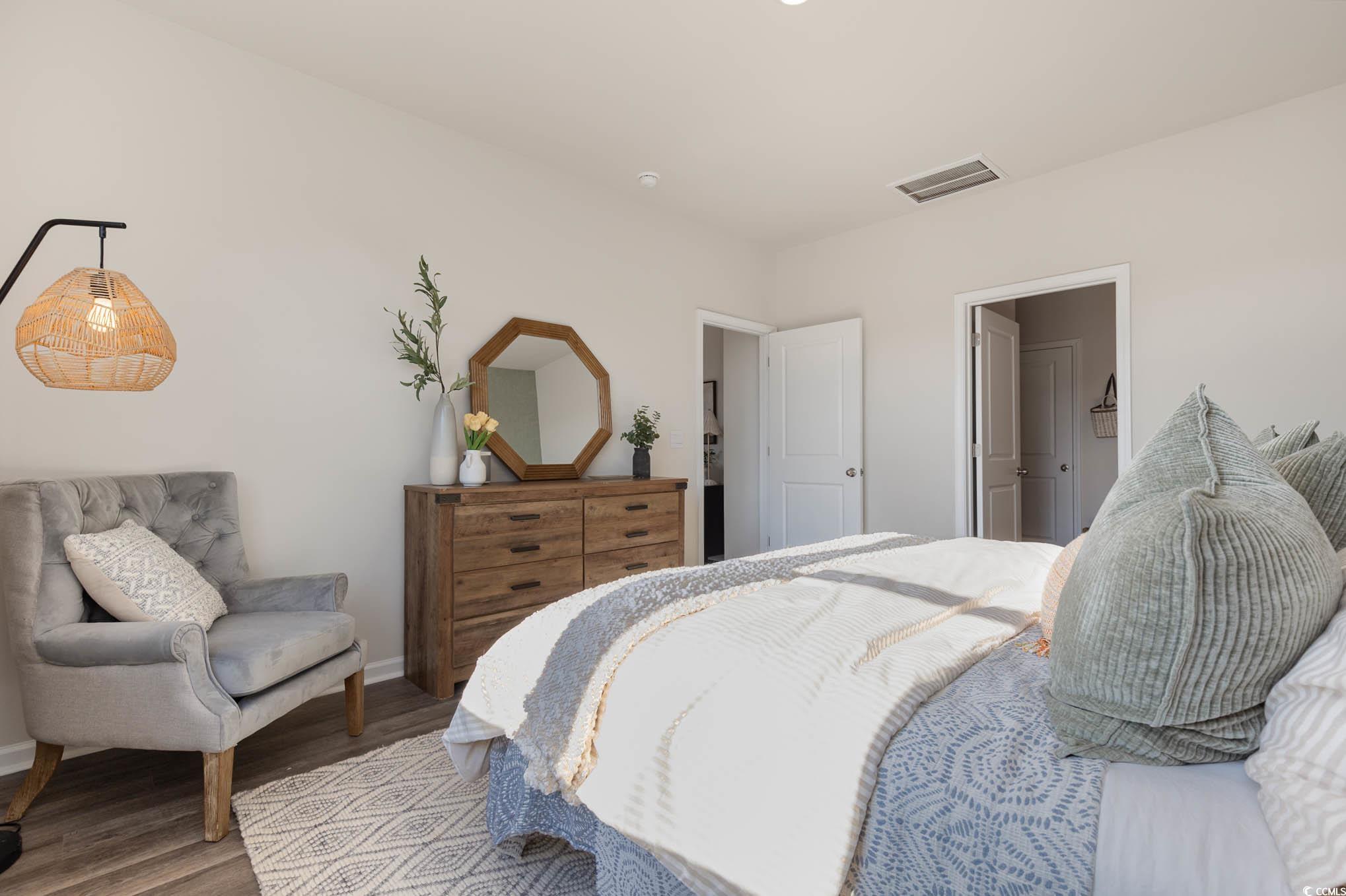 573 Duvall Street Longs, SC 29568 - Photo 11 of 14 Bedroom featuring wood-type flooring