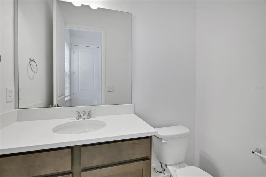 13037 Serene Glade Road Winter Garden, FL 34787 - Photo 11 of 62 a bathroom with a sink toilet and a mirror