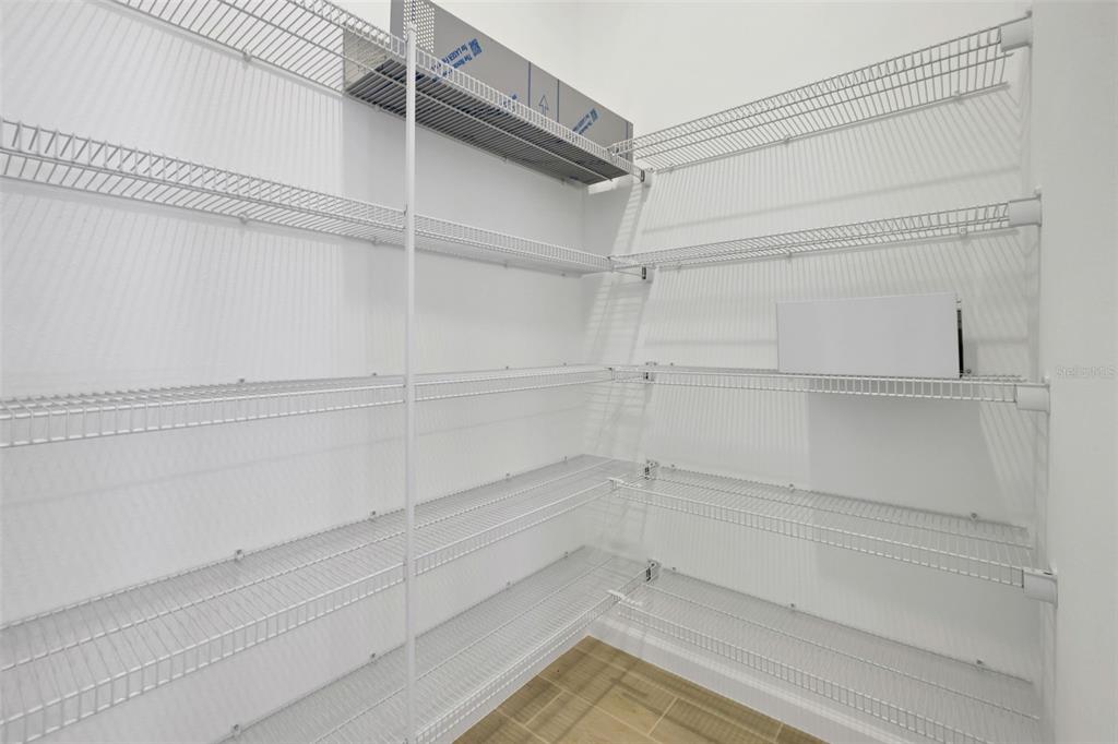 13037 Serene Glade Road Winter Garden, FL 34787 - Photo 12 of 62 a view of a room with racks on the wall