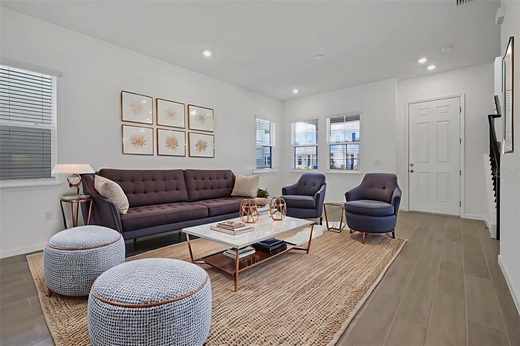 13037 Serene Glade Road Winter Garden, FL 34787 - Photo 19 of 62 a living room with furniture a rug and a window