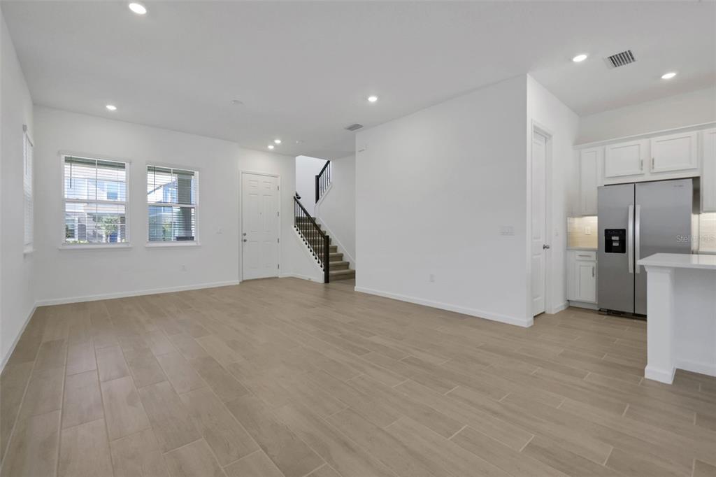13037 Serene Glade Road Winter Garden, FL 34787 - Photo 20 of 62 a view of a kitchen with refrigerator and white cabinets