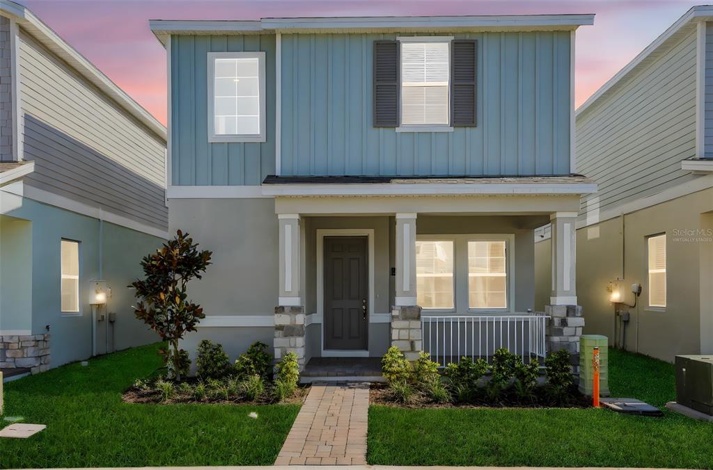 13037 Serene Glade Road Winter Garden, FL 34787 - Photo 2 of 62 a front view of a house with a yard