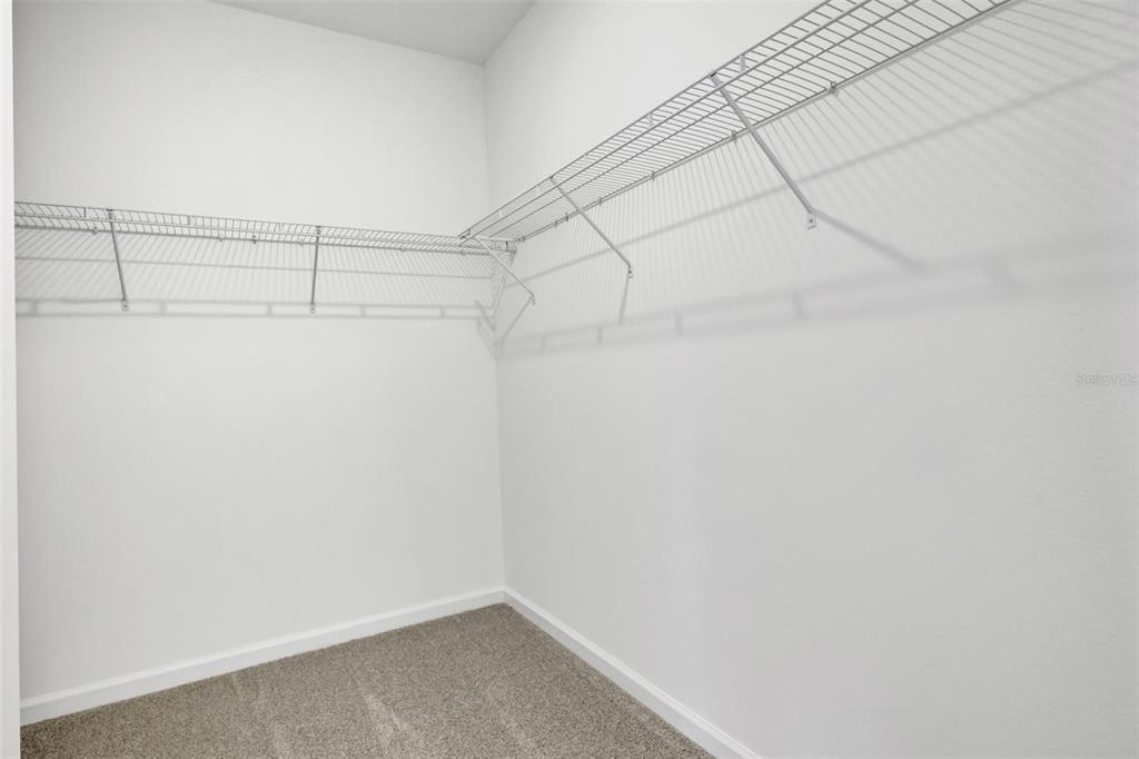 13037 Serene Glade Road Winter Garden, FL 34787 - Photo 23 of 62 a view of a room with racks on the wall