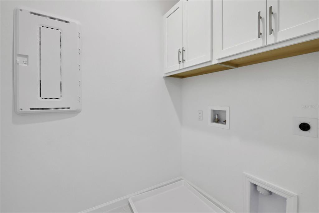 13037 Serene Glade Road Winter Garden, FL 34787 - Photo 28 of 62 a view of cabinets and wooden floor