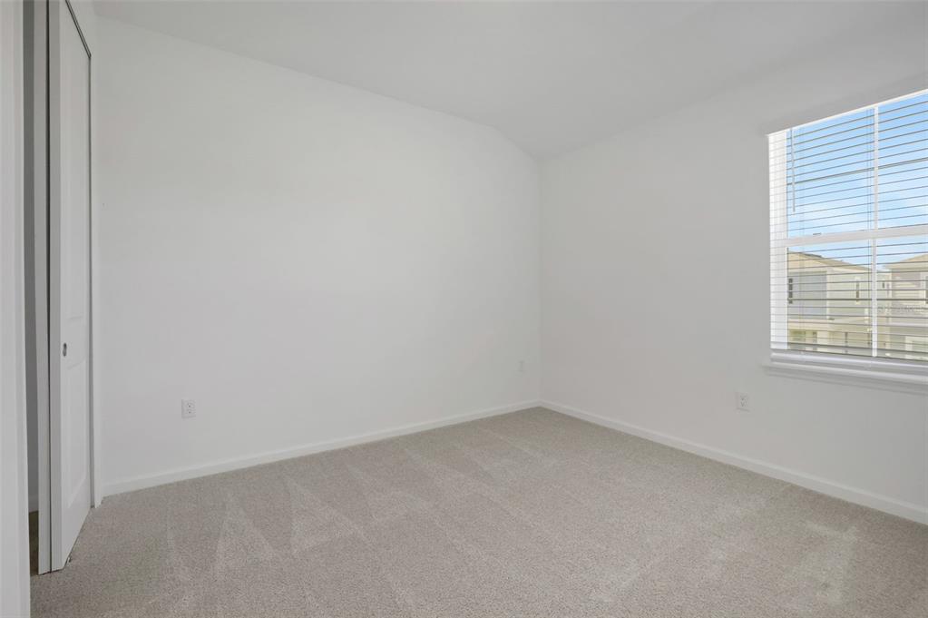 13037 Serene Glade Road Winter Garden, FL 34787 - Photo 31 of 62 an empty room with a window