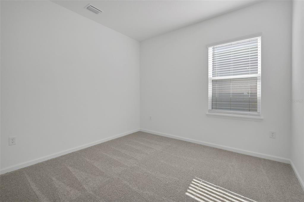 13037 Serene Glade Road Winter Garden, FL 34787 - Photo 33 of 62 an empty room with a window