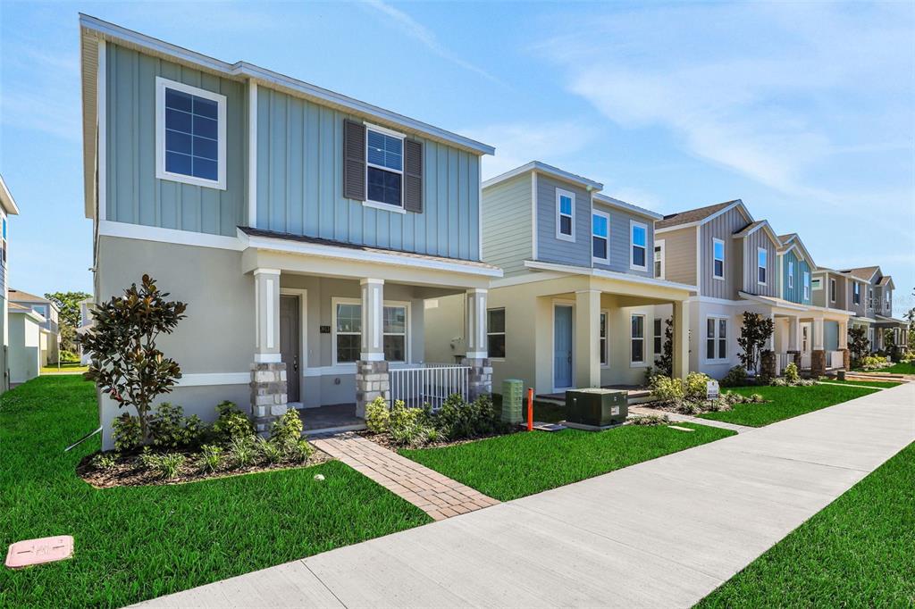 13037 Serene Glade Road Winter Garden, FL 34787 - Photo 4 of 62 a front view of a house with a yard and potted plants