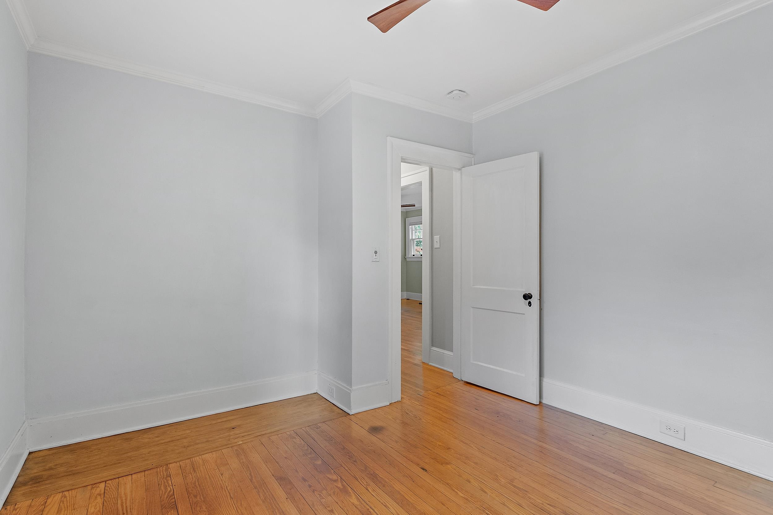 527 Euclid Street Raleigh, NC 27604 - Photo 15 of 27 a view of an empty room with wooden floor