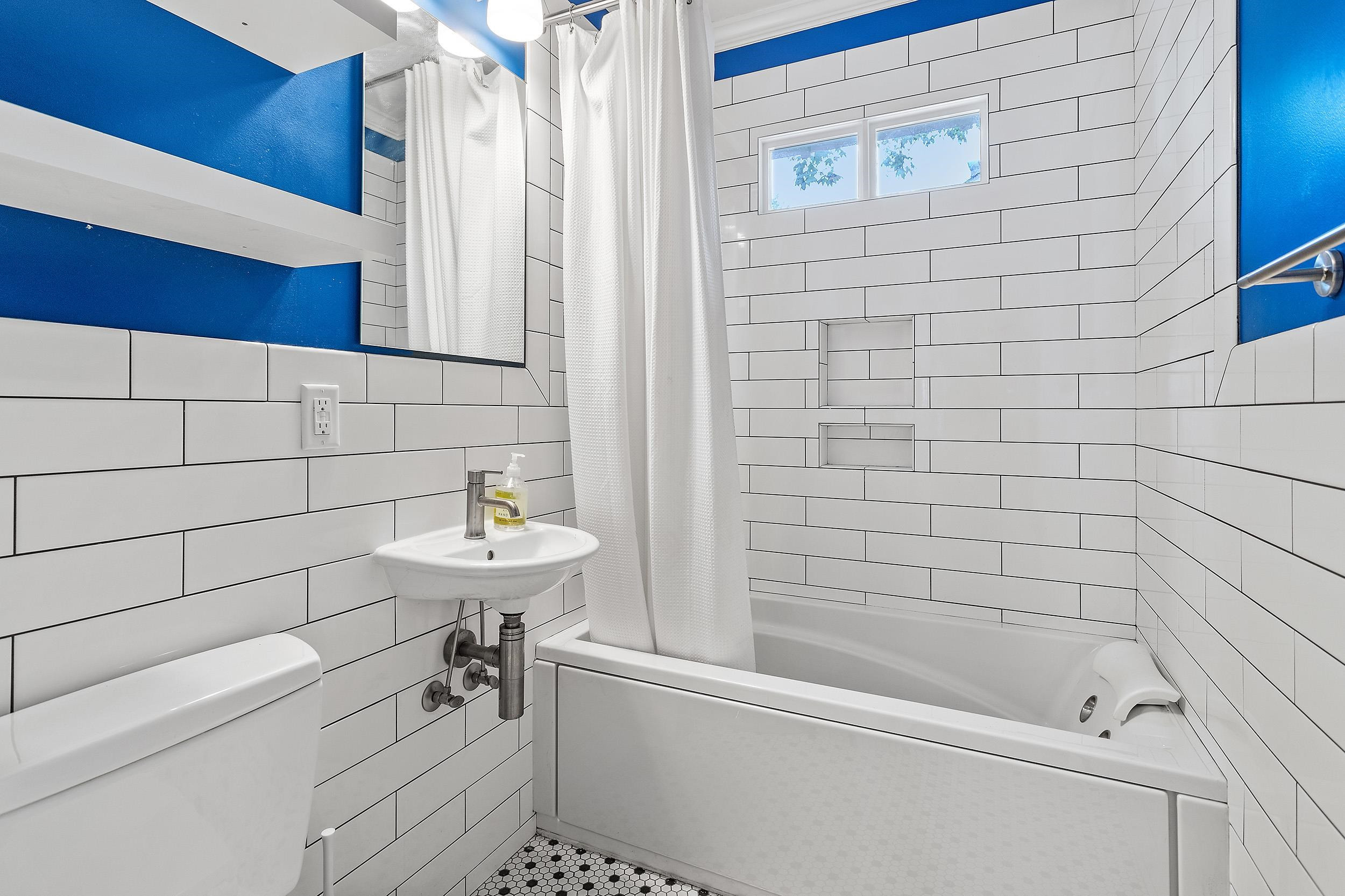 527 Euclid Street Raleigh, NC 27604 - Photo 17 of 27 a bathroom with a sink a toilet and shower