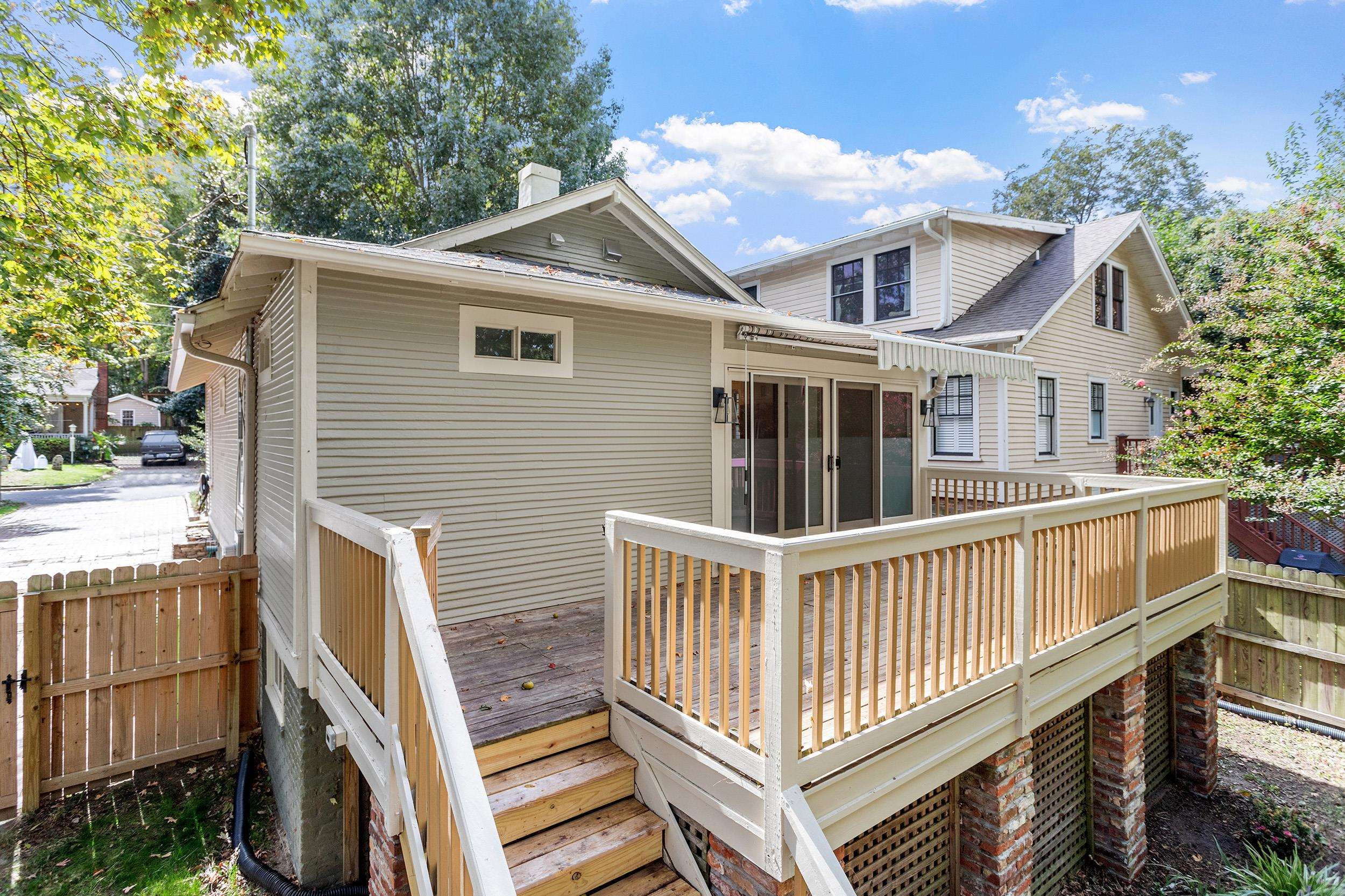 527 Euclid Street Raleigh, NC 27604 - Photo 21 of 27 a view of a house with wooden deck and a yard