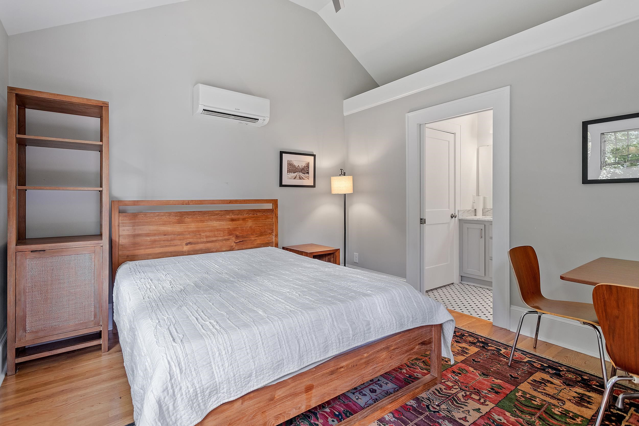 527 Euclid Street Raleigh, NC 27604 - Photo 24 of 27 a bedroom with a bed and chair