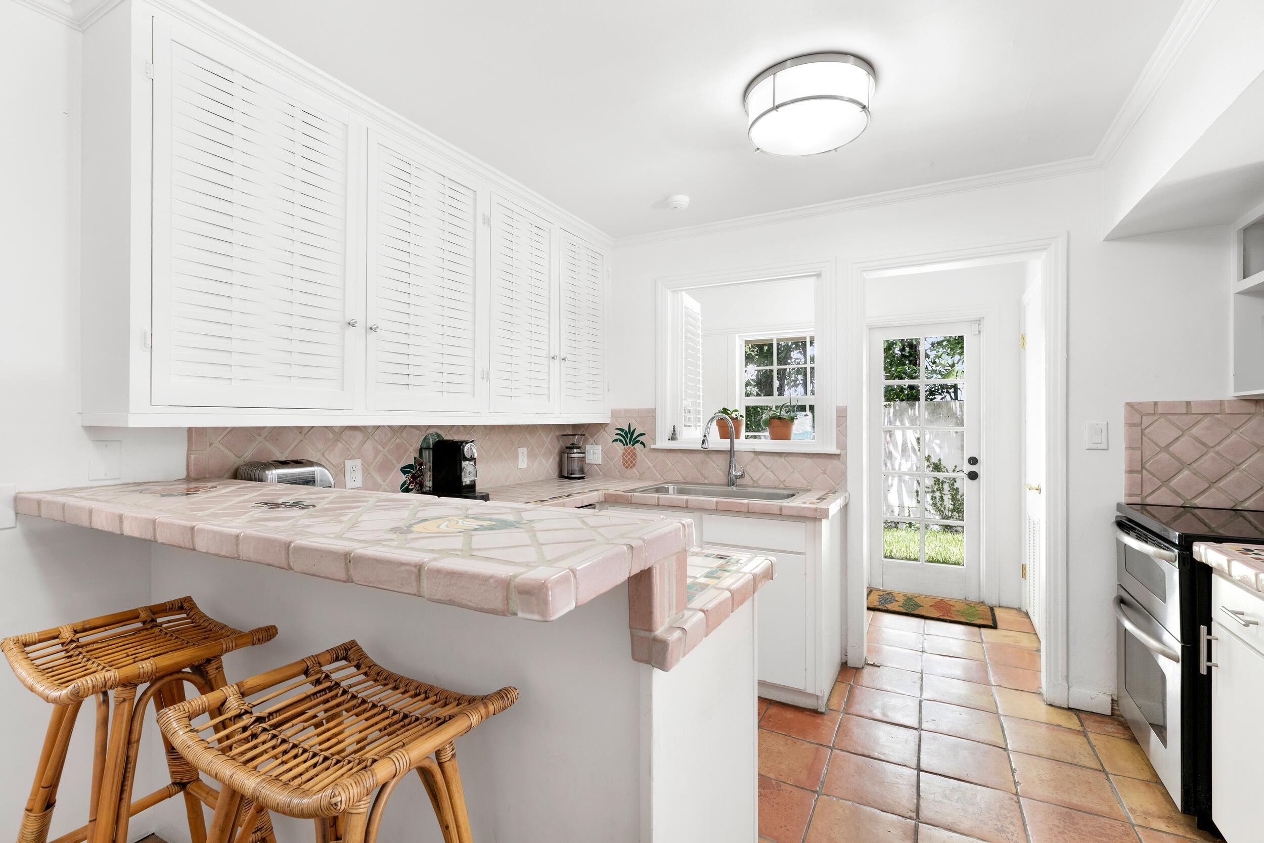 285 Orange Grove Road Palm Beach, FL 33480 - Photo 15 of 29 a kitchen with a sink cabinets and appliances