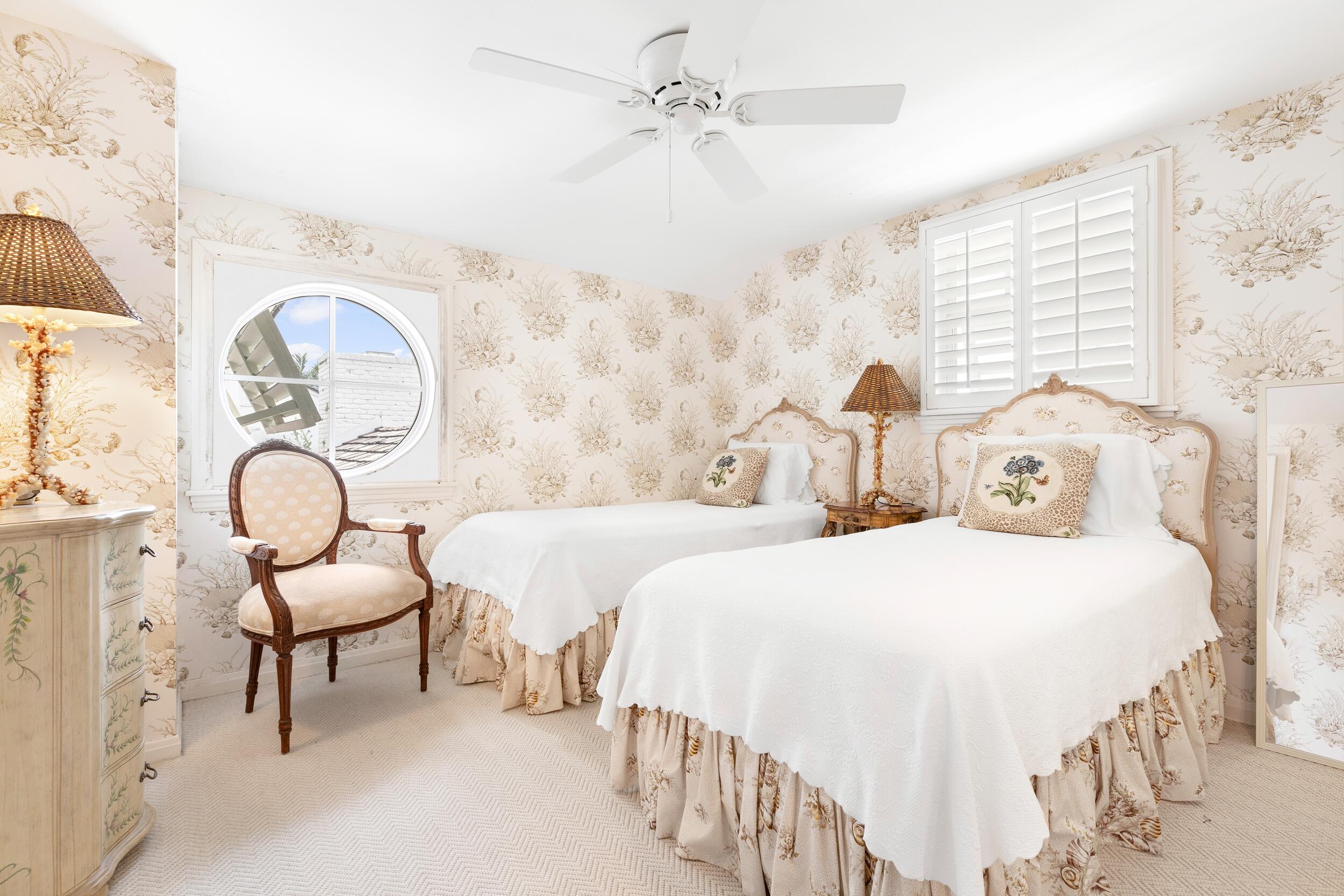 285 Orange Grove Road Palm Beach, FL 33480 - Photo 21 of 29 a bedroom with two beds and a large mirror