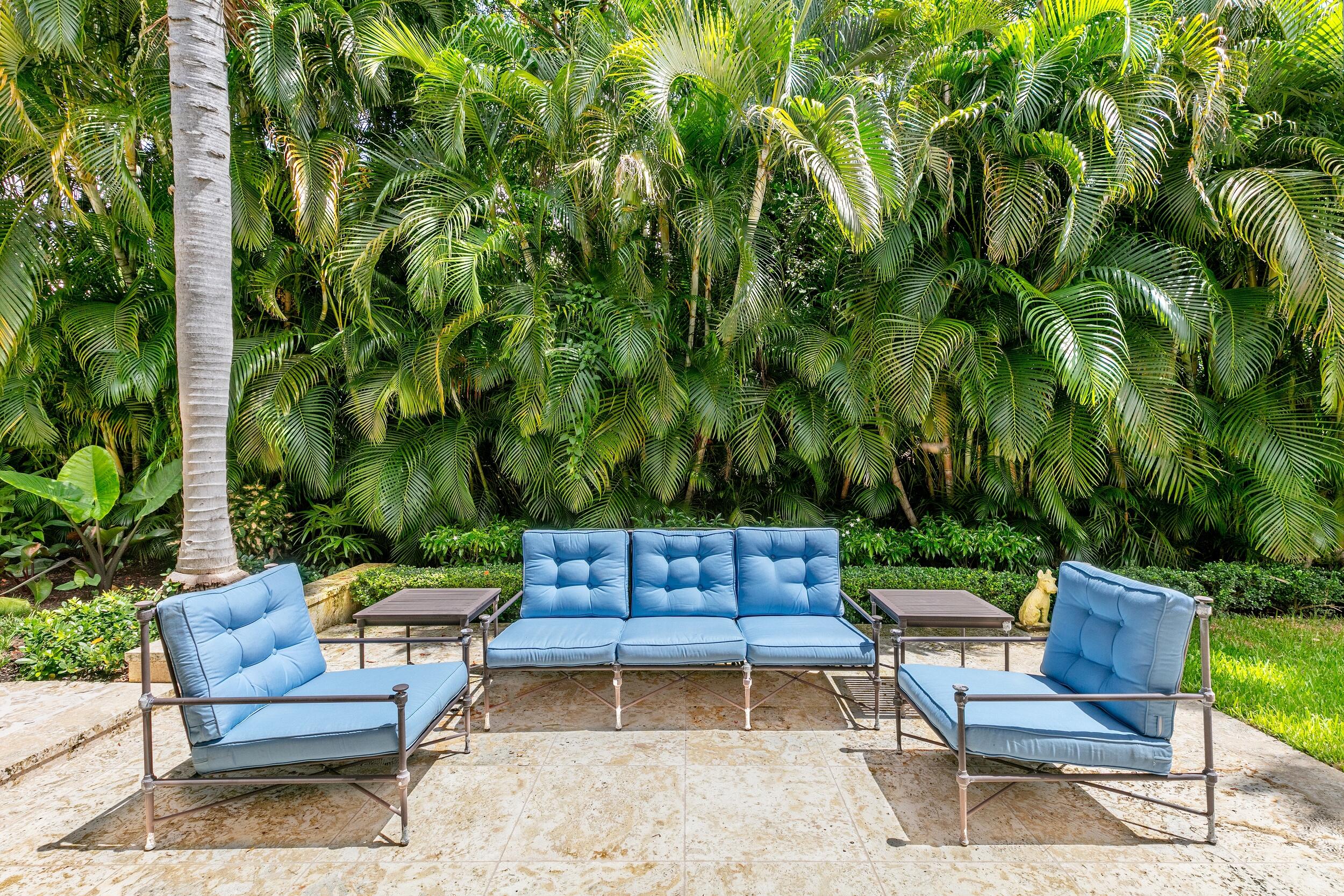 285 Orange Grove Road Palm Beach, FL 33480 - Photo 27 of 29 a backyard of a house with outdoor seating