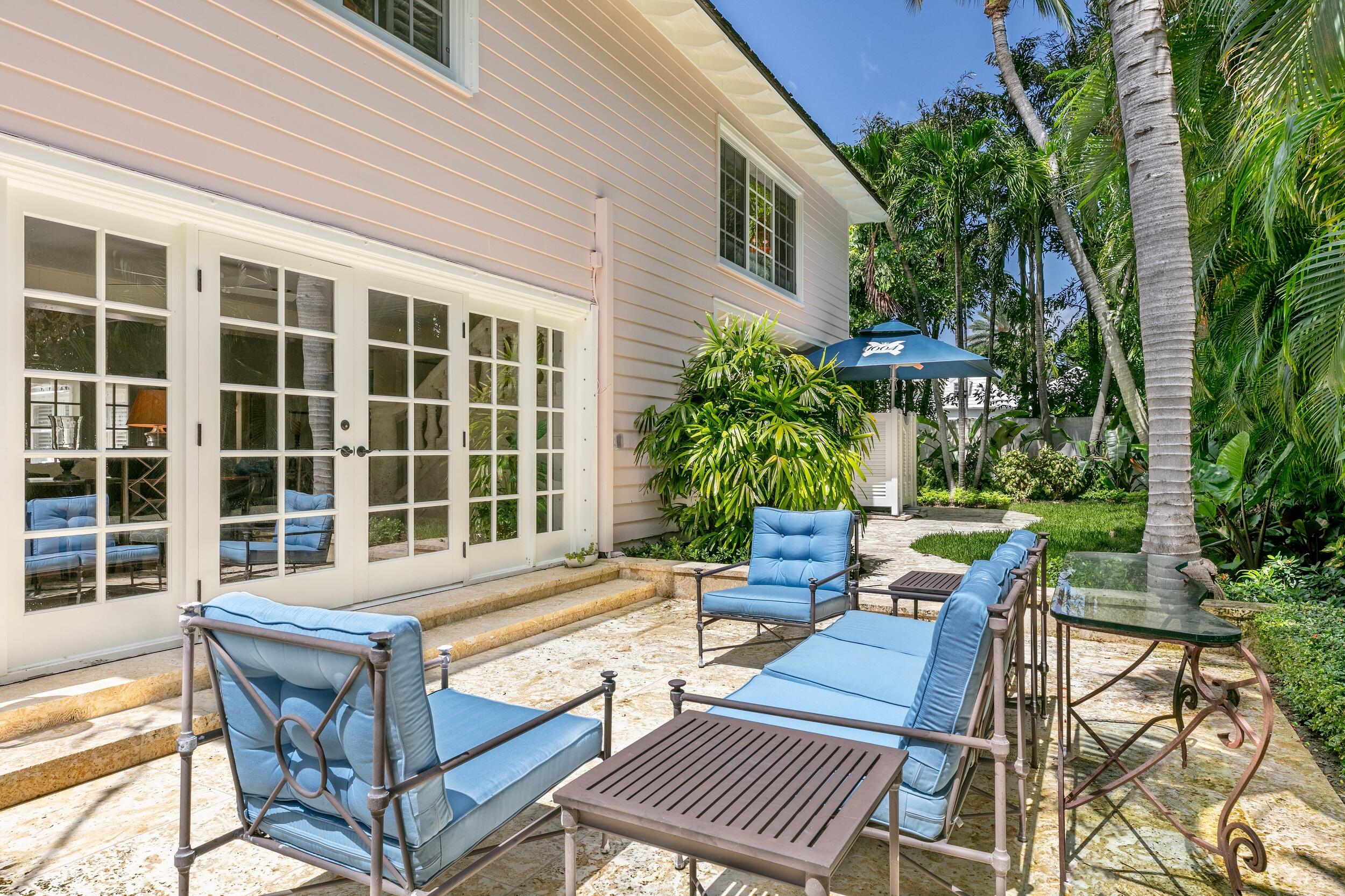 285 Orange Grove Road Palm Beach, FL 33480 - Photo 28 of 29 swimming pool with outdoor seating and yard