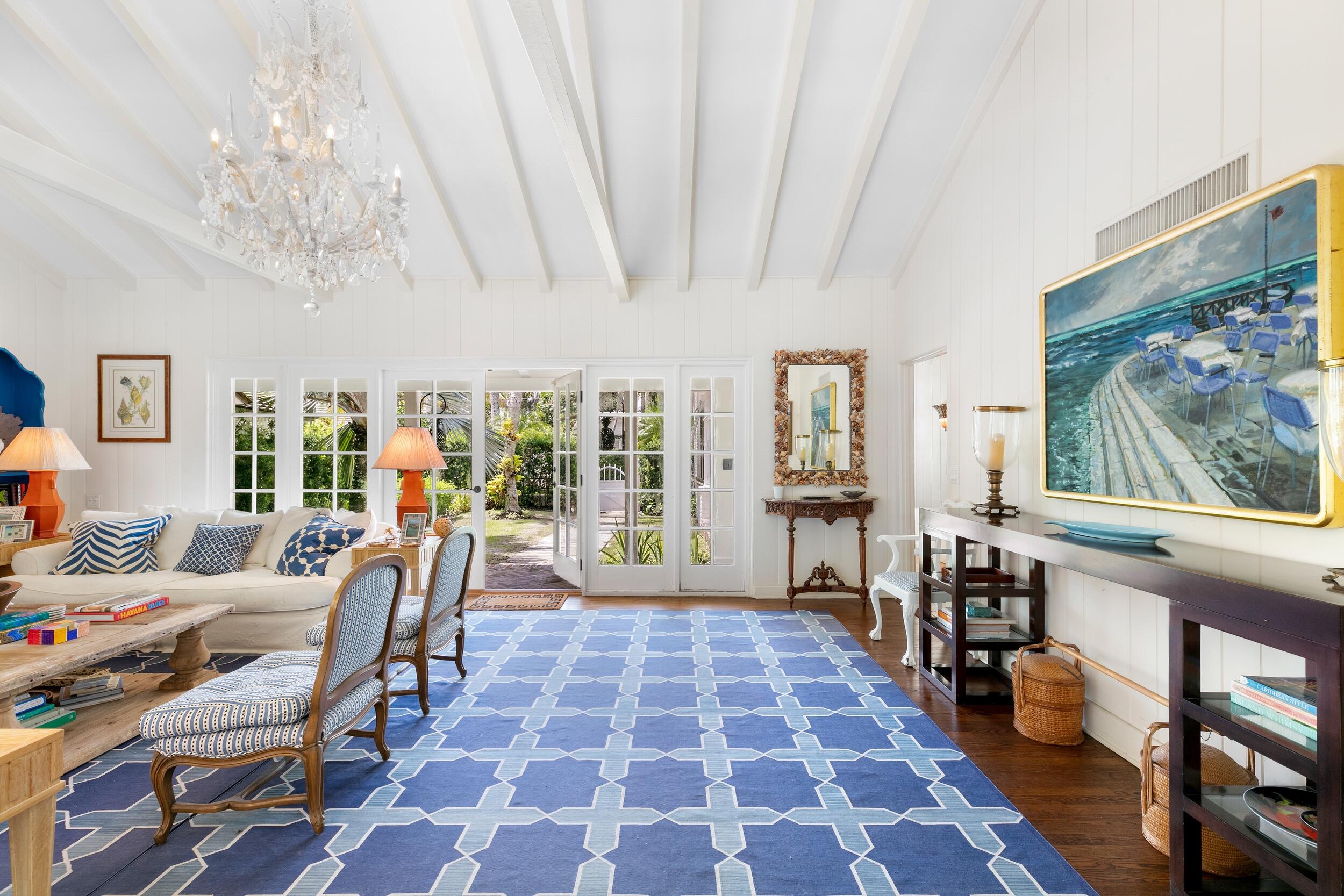 285 Orange Grove Road Palm Beach, FL 33480 - Photo 6 of 29 a living room with furniture and a chandelier