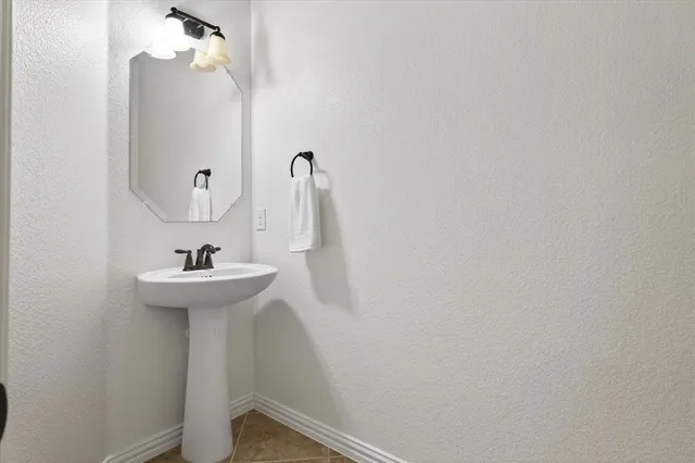 a white toilet sitting next to a shower