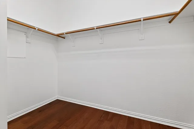 a bathroom with a glass shower door and mirror