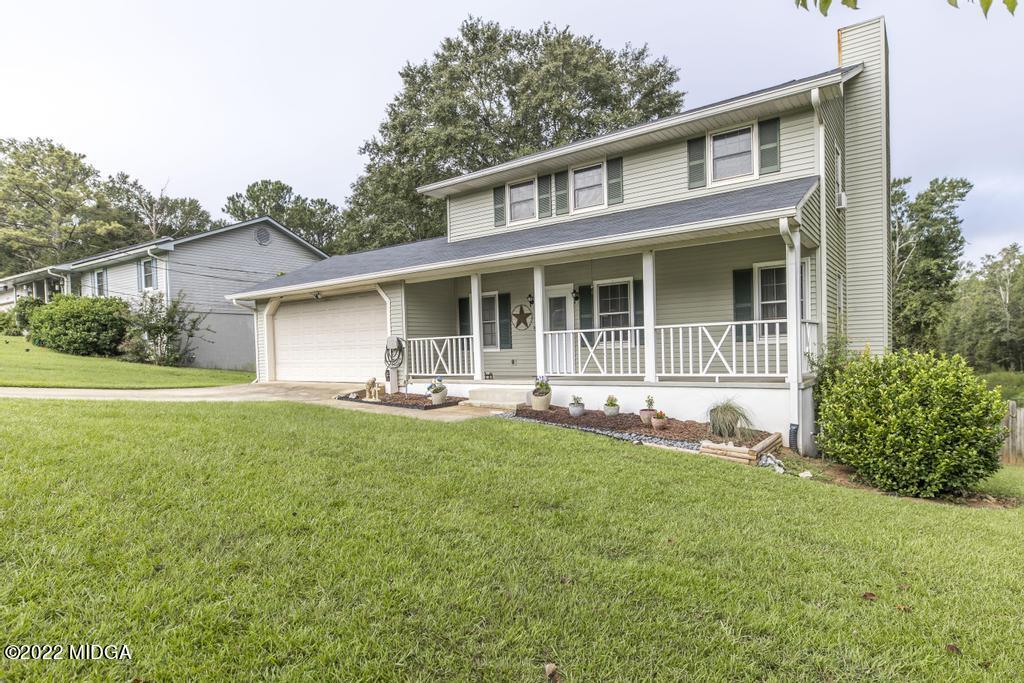 115 Coley Lake Road Macon, GA 31216 - Photo 1 of 42 a front view of a house with yard and green space