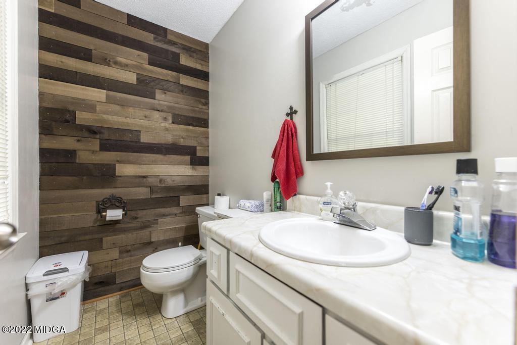 115 Coley Lake Road Macon, GA 31216 - Photo 11 of 42 a bathroom with a sink and a toilet