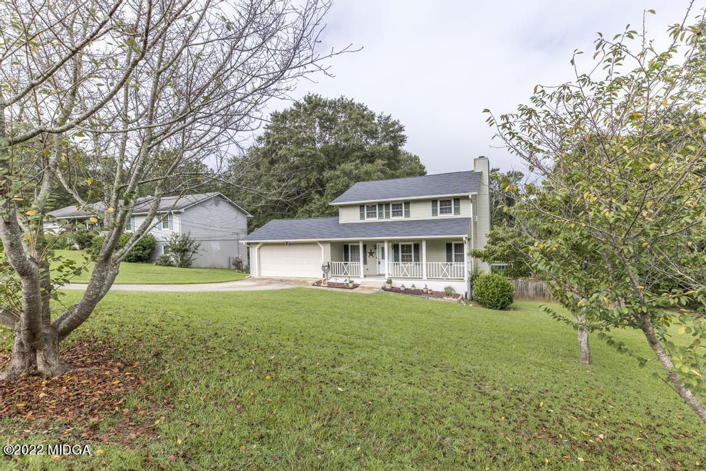 115 Coley Lake Road Macon, GA 31216 - Photo 15 of 42 a view of a house with a yard and potted plants